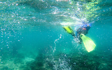 Images of men underwater snorkeling
