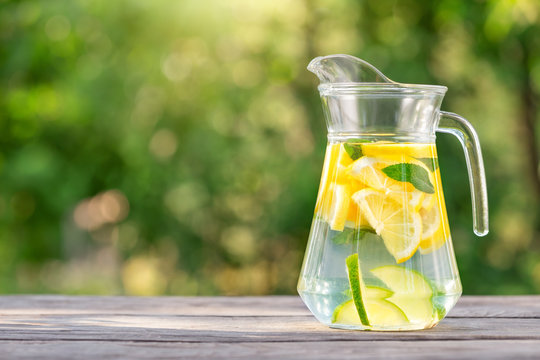 Pitcher of homemade lemonade on wooden table