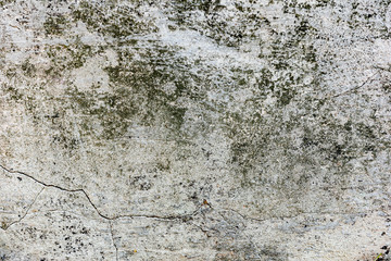 Texture of a concrete wall with cracks and scratches which can be used as a background