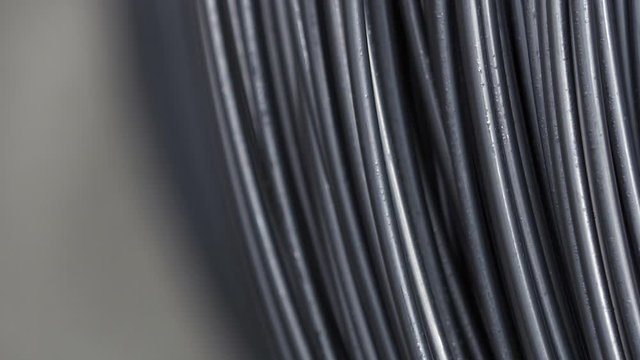 Pile of iron, metal wire rod or coil for Construction industry. steel wire fence rolls. Steel wire tie rolls for construction and industrial. Coil of iron or steel.