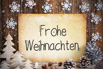 Obraz na płótnie Canvas Old Paper With German Text Frohe Weihnachten Means Merry Christmas. Christmas Decoration Like Tree, Fir Cone And Snow. Brown Wooden Background
