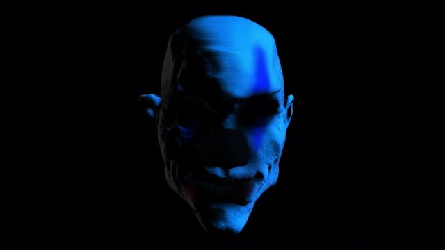Creepy seamless animation of an horror clown mask and colorful lights. Halloween background of a terror character with alpha channel
