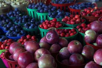 Biologic, natural cultivated apples on a market counter. Fruits from the farmers market.