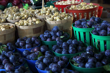 Biologic, natural cultivated plum on a market counter. Fruits from the farmers market.