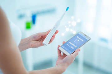 Wireless connection ultrasonic electric toothbrush with smart phone app. Modern home technology...