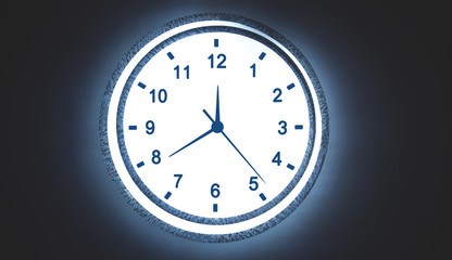Clock on the circular white glow on dark background.