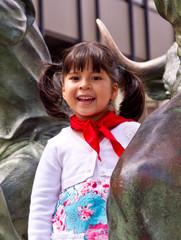Little girl with the bulls