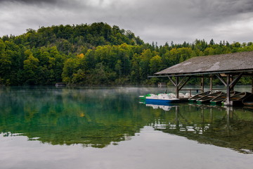 Fototapeta premium Fog over the water. The morning landscape with fog. Autumn morning. Traveling in Germany, Europe. Mountain Lake