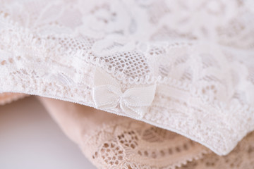 Close up of women's lace panties on white background. Delicate Female underwear texture.