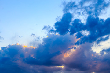 Bright cumulus clouds against the blue sky. Sunset sky Natural background