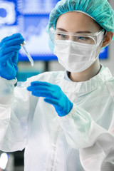 asian scientist take petri dish