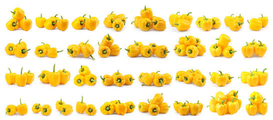 Set of fresh yellow bell peppers on white background