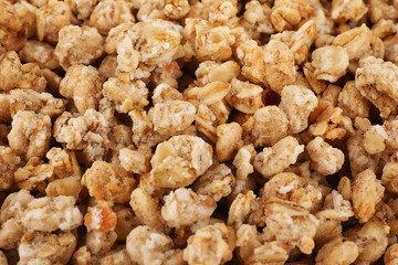 Healthy crunchy granola as background, closeup view