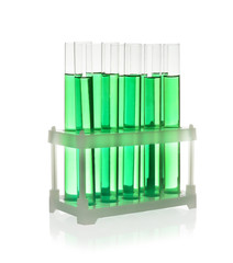 Test tubes with green liquid on white background