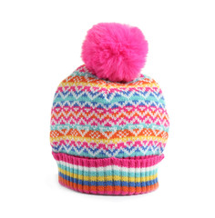 Warm knitted hat with pink pompom on white background