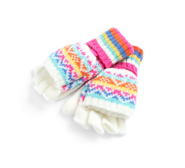Warm knitted kid's mittens on white background