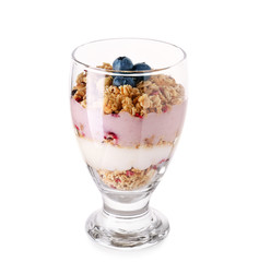 Dessert with blueberry and oat flakes in glass on white background