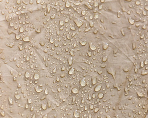 Raindrops on a tent as an abstract background