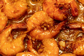 Shrimp fried in a pan in oil