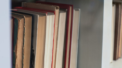 Old books on the bookshelf. Library