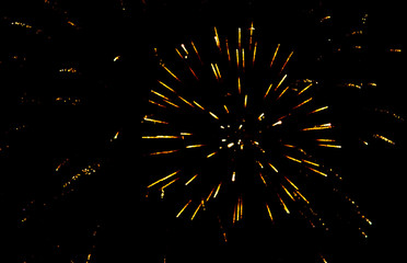 Fireworks sparkles in the night sky as background