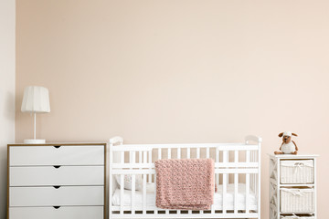 Interior of stylish children's room with baby bed