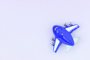 Airplane toy top view, travel concept. Flat lay, copy space