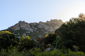 Views of the Pedriza mountain, in Madrid, Spain, in the early hours of the morning when the sun rises between the granite rocks