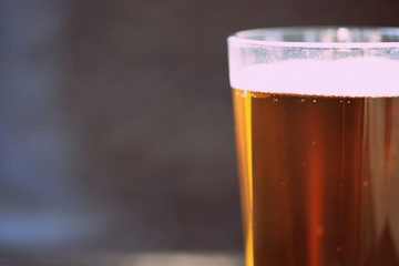 Glass with a light beer closeup in retro style