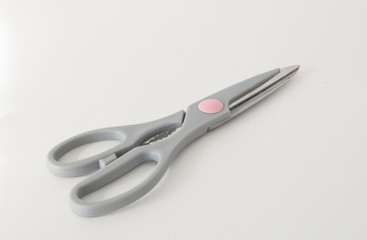 Gray scissors and a stationery knife