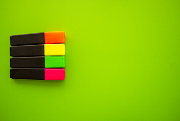 Felt pens on green background top view. Banner template with highlighters and copy space, flat lay. Education and business theme. Back to school.