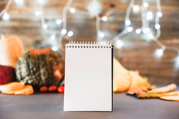 Naklejka na ściany i meble Blank notebook with vegetables on table