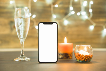 Glass of champagne with candle on table