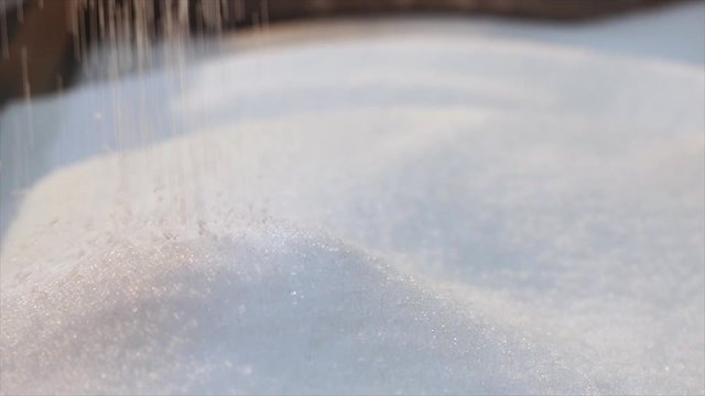 Polypropylene granules closeup slowmotion, polypropylene drop. Plastic granules fall in slow motion