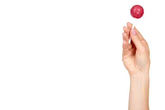 Hand with color lollipop, bright cool candy.