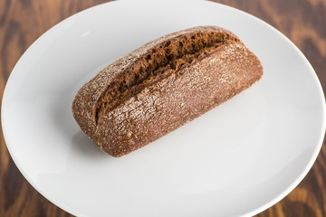 rye bread loaf on a white plate