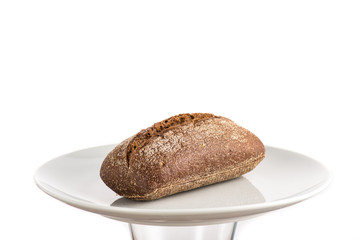 rye bread loaf on a white plate