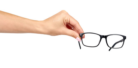 Hand with black eyeglasses, eye optic correction tool.