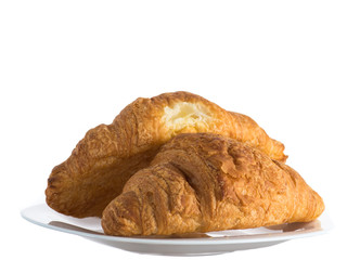 two croissants on a white plate on a white background
