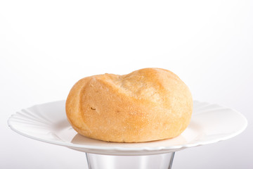 bun baking on a white plate or in a transparent bag on a white background