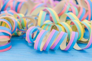 To celebrate a party. We have fun and many colorful streamers decorate us wooden table.