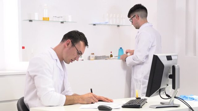 two colleagues and pharmaceutical workers invent new drugs