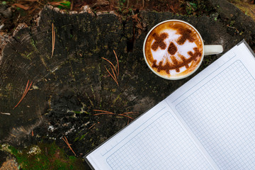 Coffee cup as jack o lantern pumpkin