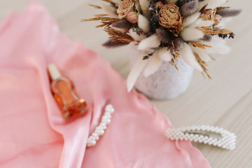 Fototapeta na wymiar bridal bouquet and hair accessories. Close-up wedding details. Beauty fashion blog concept. Stylish feminine accessories flatlay