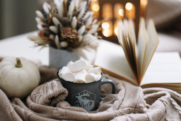Seasonal home autumn decoration with dried flowers and white pumpkin. Cozy warm image, hygge style