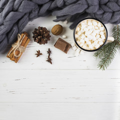 Winter composition with hot chocolate on wooden table