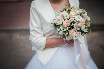 Colorfull flowers in the hand of the bride