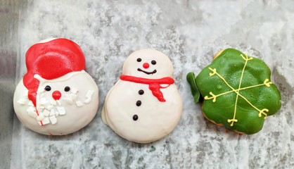 Christmas sweet donuts and cookie on tray