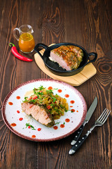 oven-baked meat with braised cabbage and zucchini and hot spicy sauce