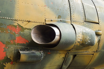 Details of the fuselage of an old aircraft. Old camouflage surface with exfoliated paint and rivets...